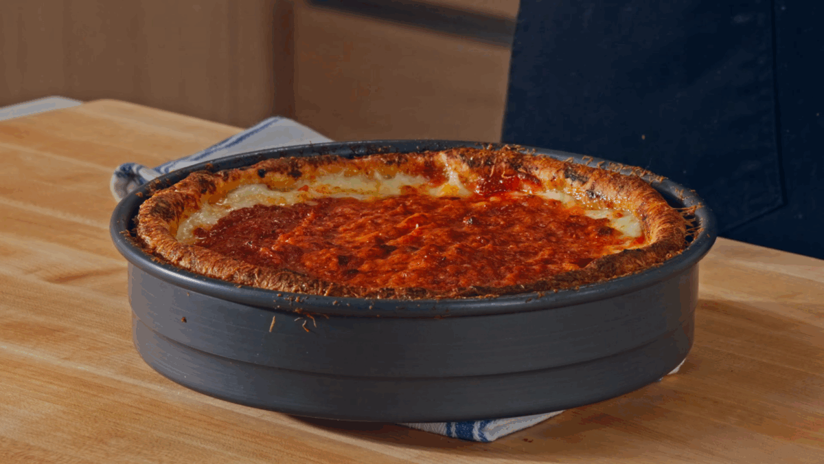 A baked deep dish pizza in a pan. 