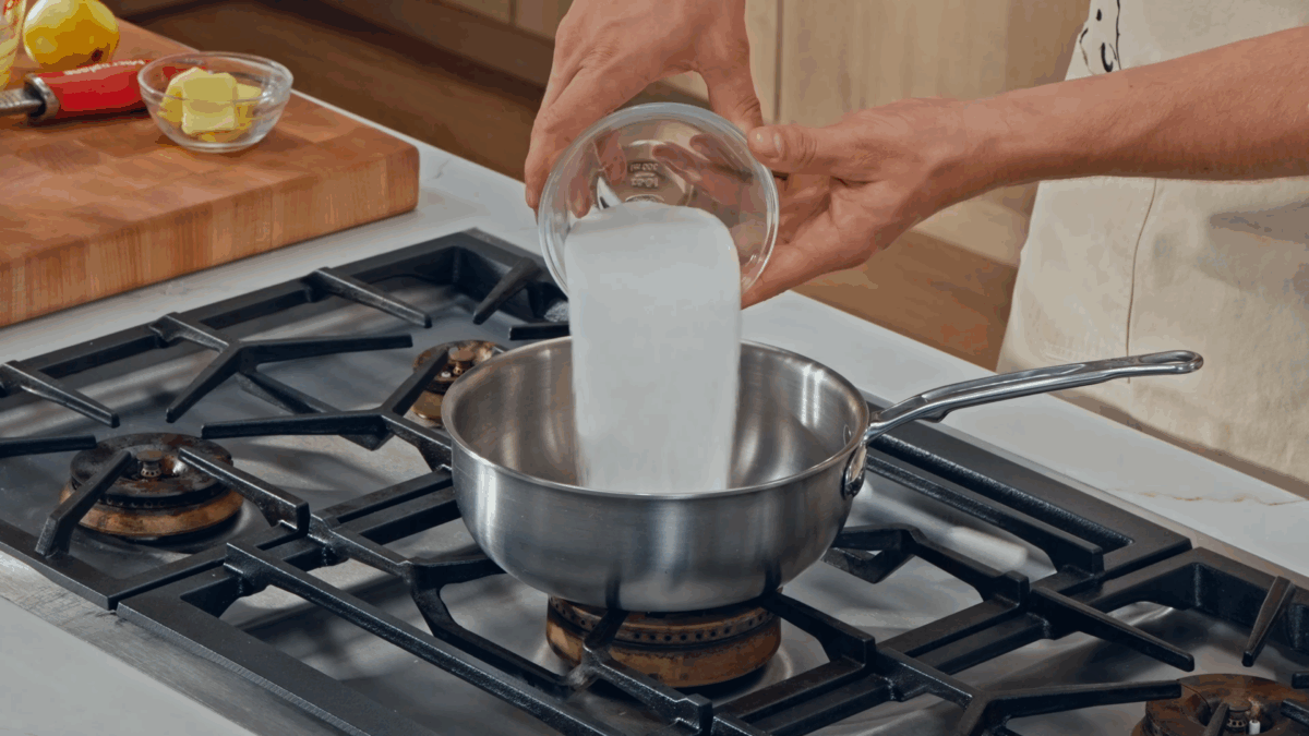 Nick DiGiovanni combining ingredients for lemon filling in a saucepan.