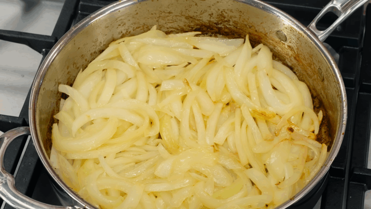 Onions cooking in a pot.