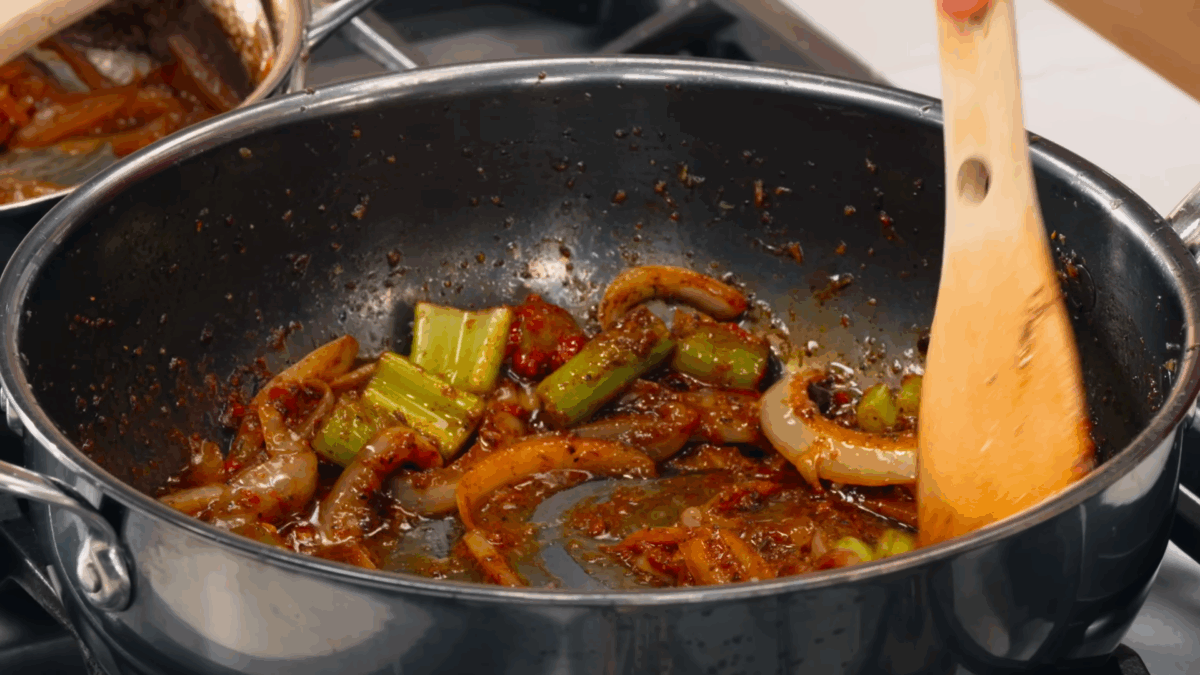 The base of an au jus mixture cooking in a sauté pan.