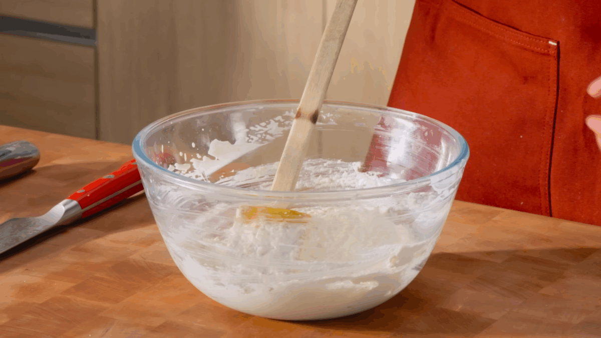 A bowl of horseradish sauce, a spatula sticking out.