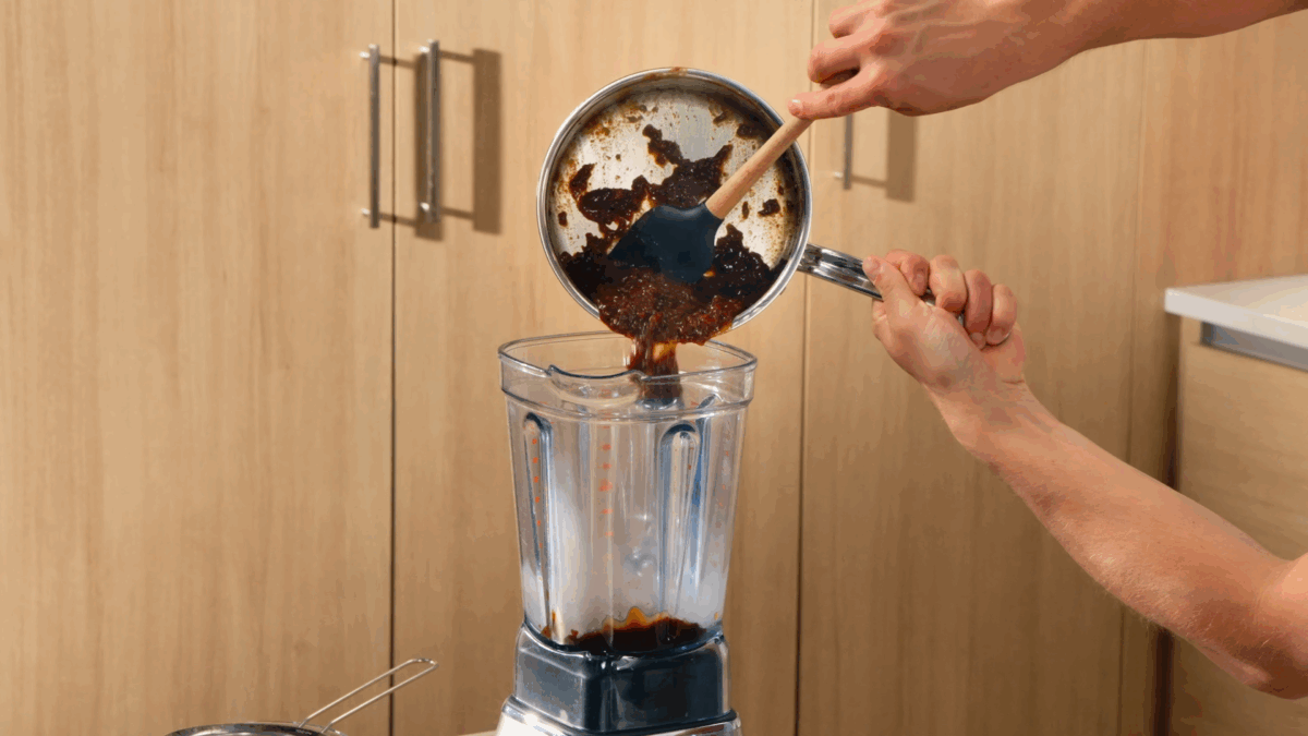 Nick DiGiovanni transferring tonkatsu sauce to a blender. 