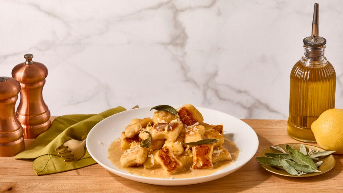 A bowl of homemade gnocchi with a lemon butter sage sauce.