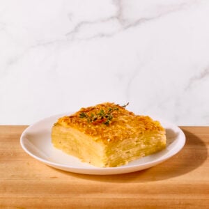 A serving of potato gratin on a plate.