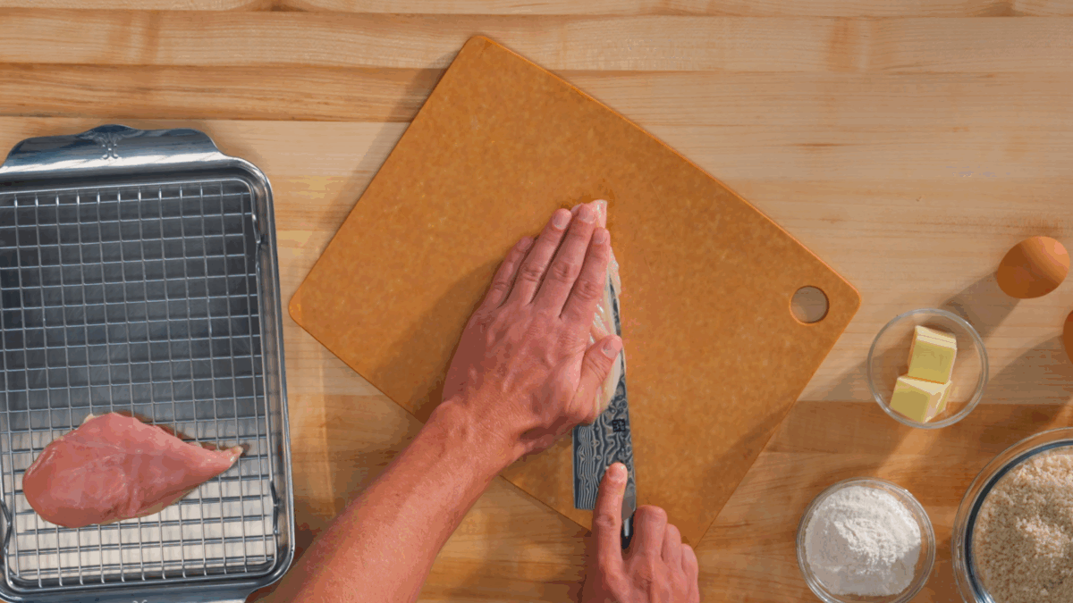 Nick DiGiovanni slicing a chicken breast for cutlets.