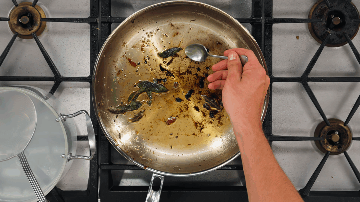 Nick DiGiovanni crisping sage leaves in a pan of oil and butter. 