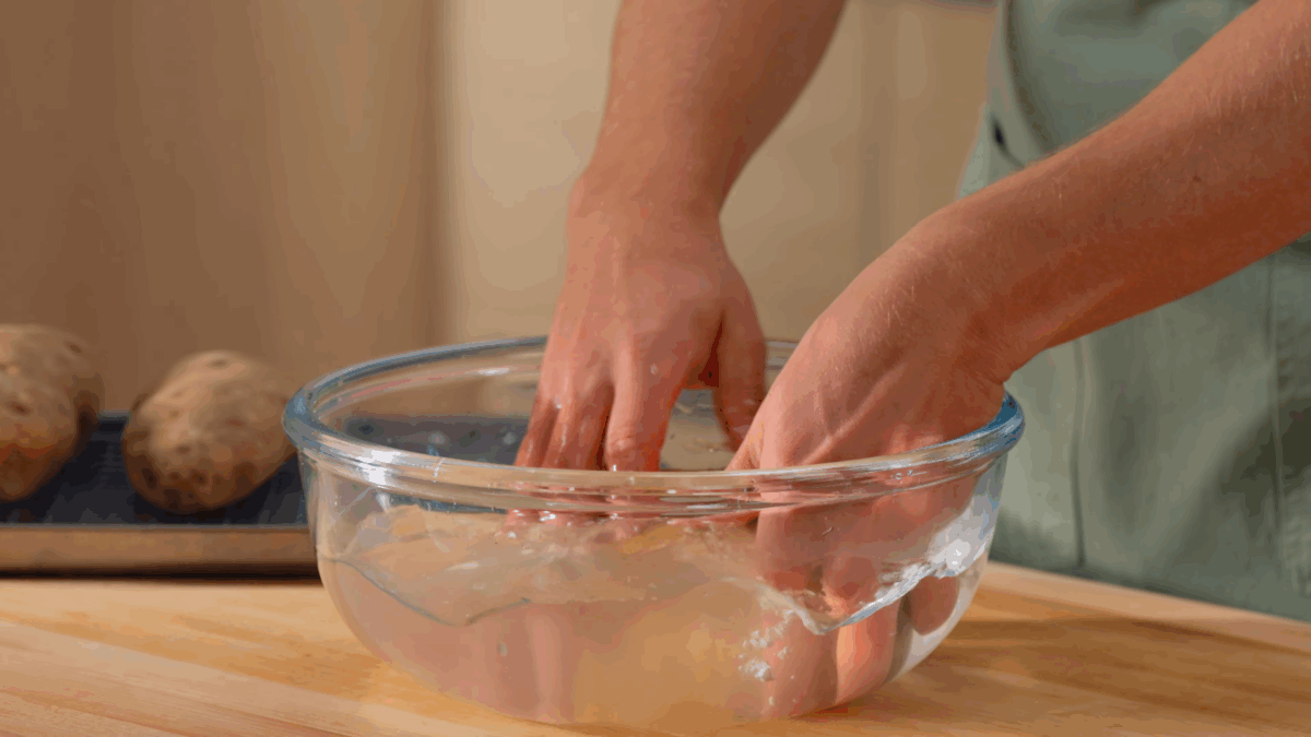Nick DiGiovanni dunking potatoes in a salt brine. 