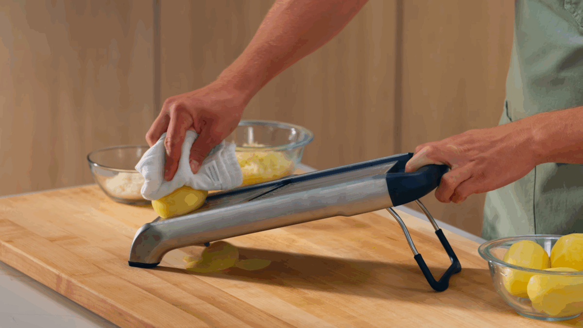 Nick DiGiovanni using a ma to slice potatoes. 