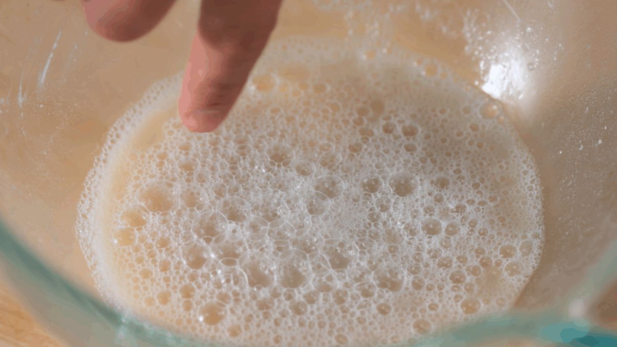 Nick DiGiovanni activating yeast in a bowl.