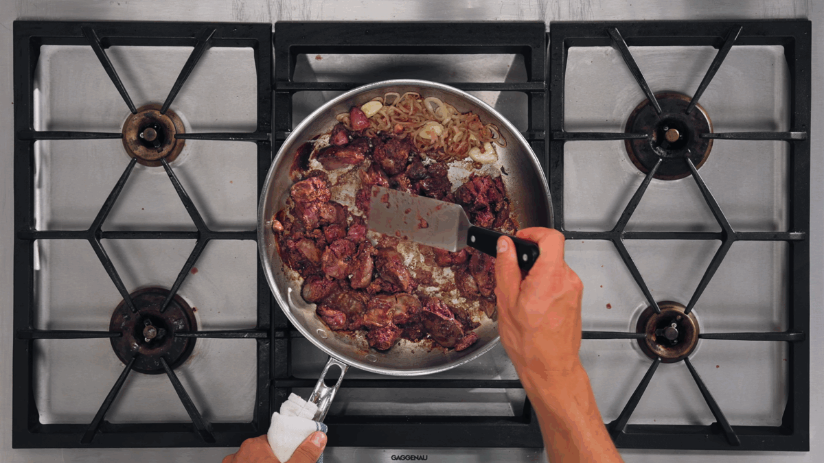 Nick DiGiovanni cooking chicken livers with shallots and garlic.
