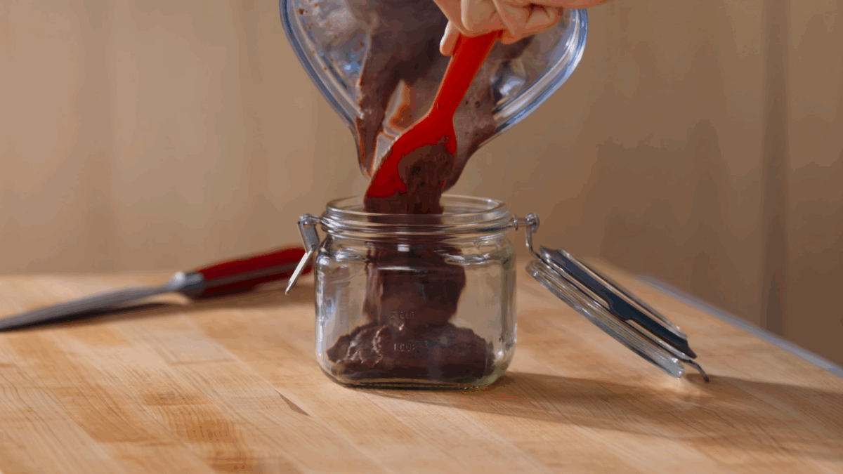 Nick DiGiovanni transferring pate from a blender to a jar. 