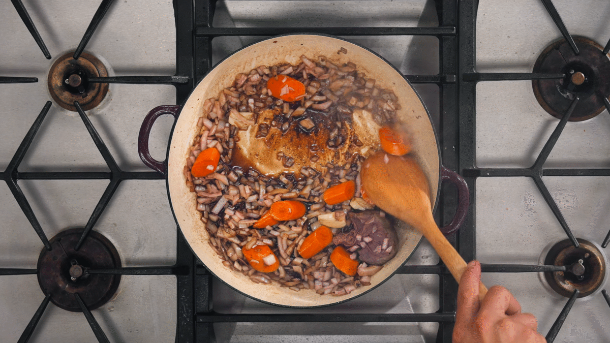 Nick DiGiovanni sautéing vegetables for beef bourguignon.
