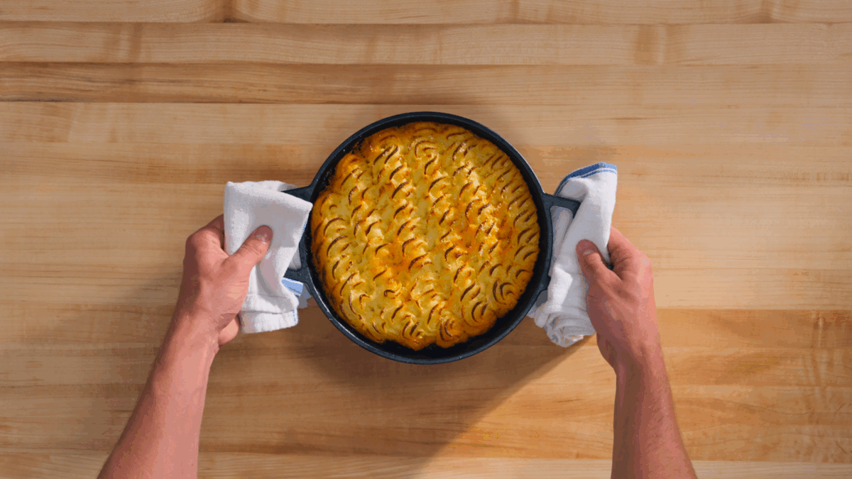 Nick DiGiovanni holding a baking dish of shepherd's pie.
